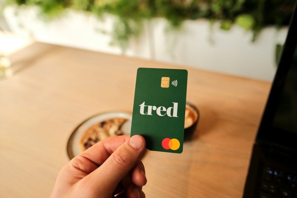 a person holding a credit card with the word tried on it