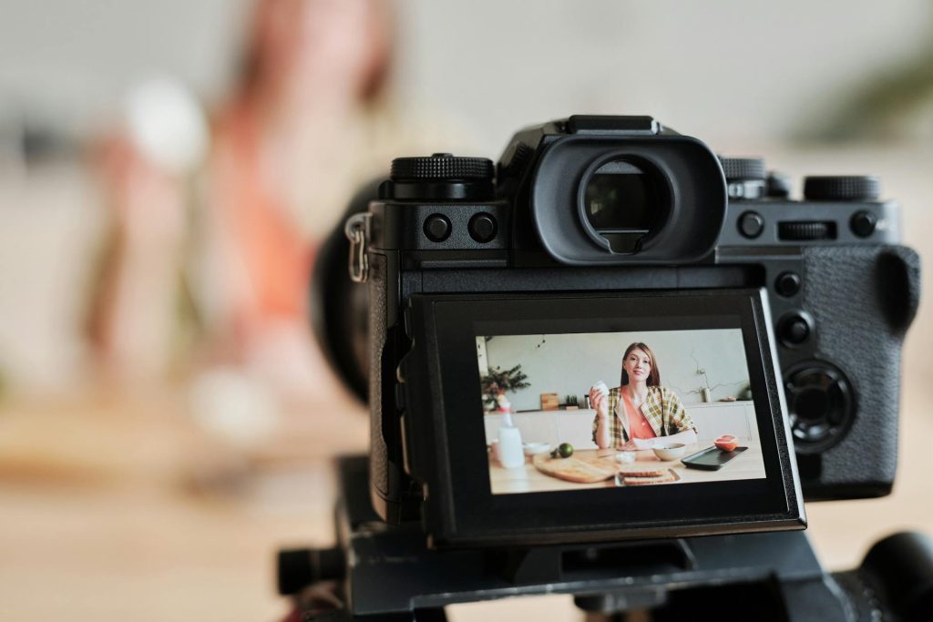 Woman Sitting Shooting in the Kitchen